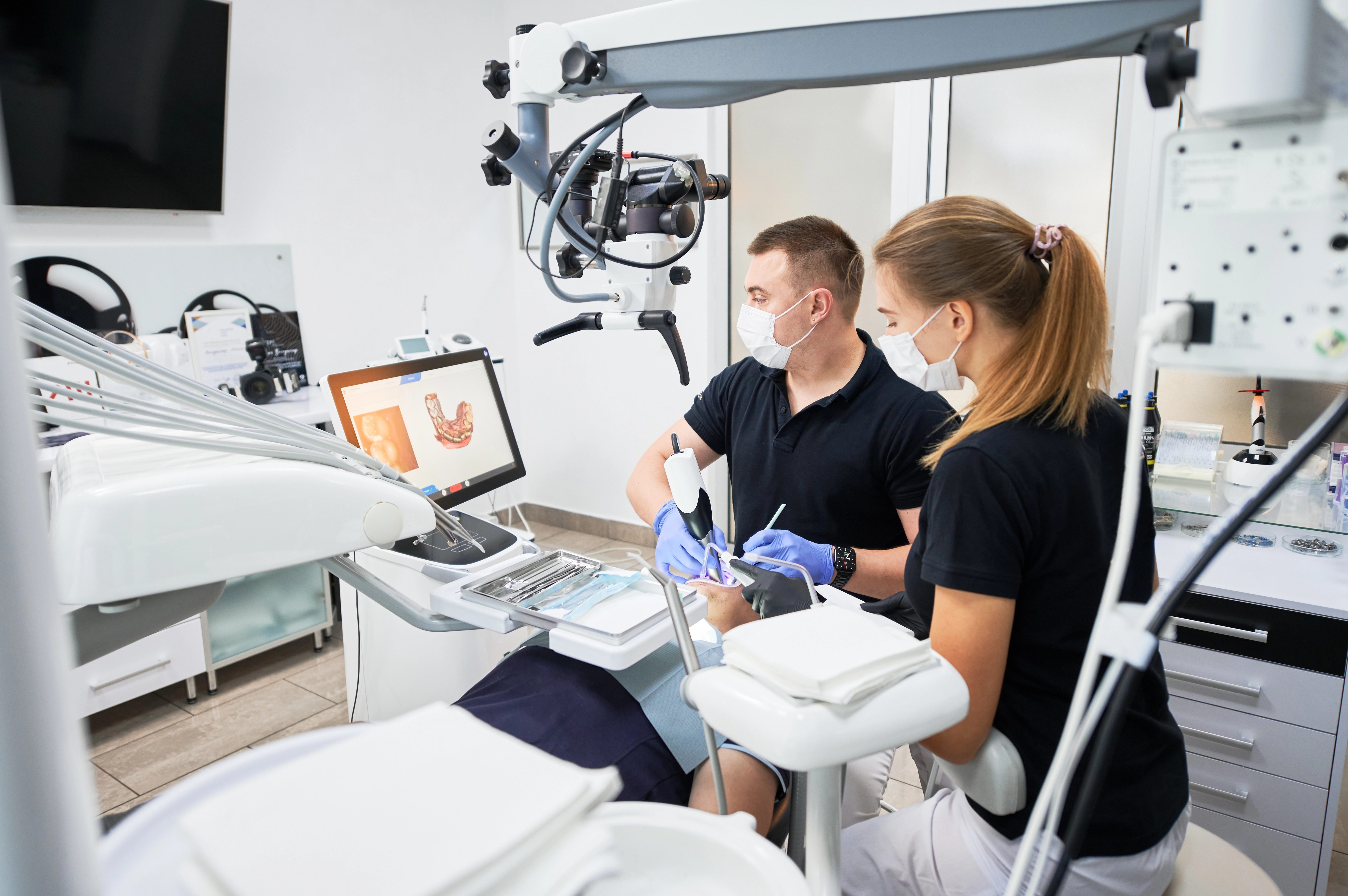 Dental professionals using advanced technology at McColl Dental Center